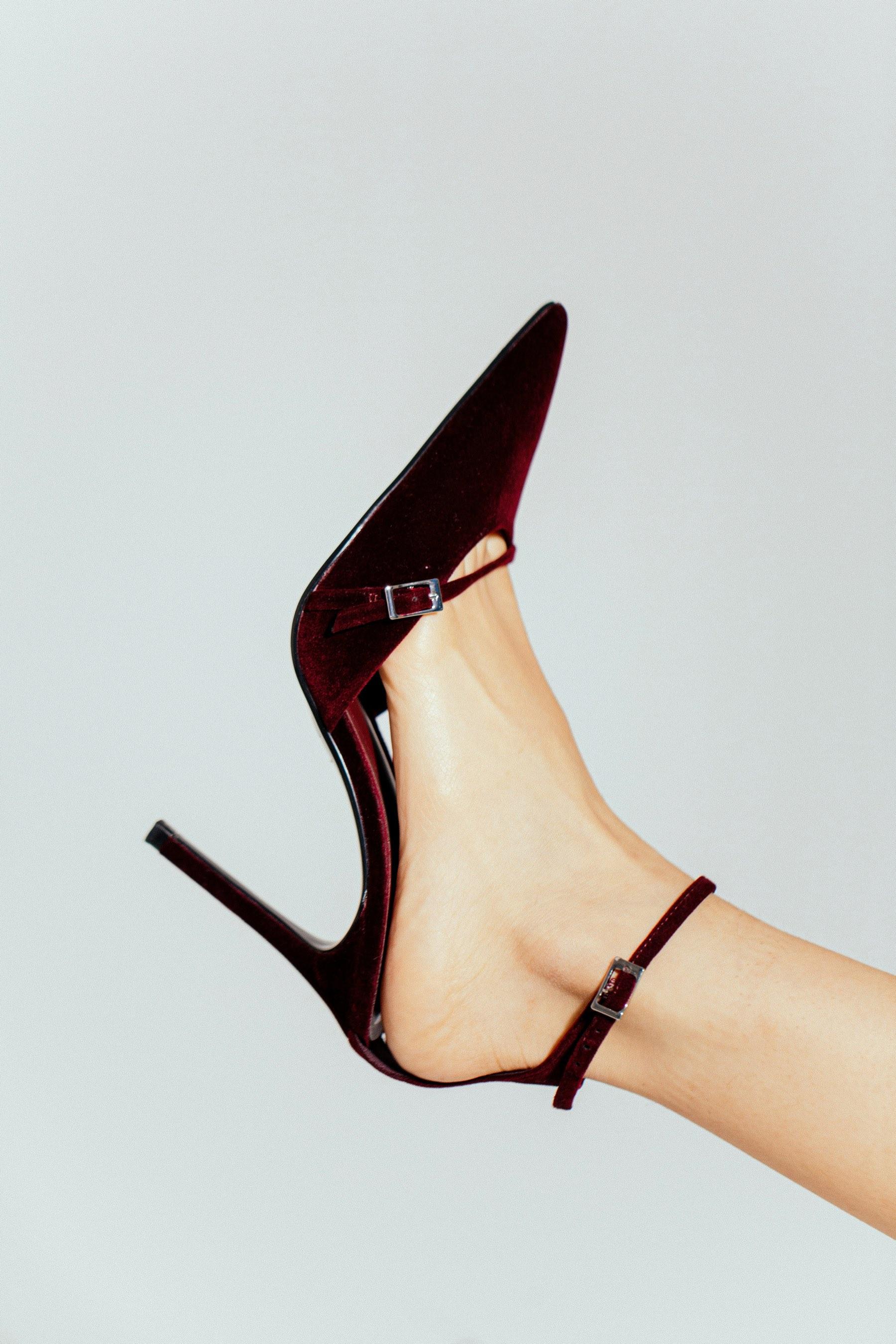 A burgundy velvet heel