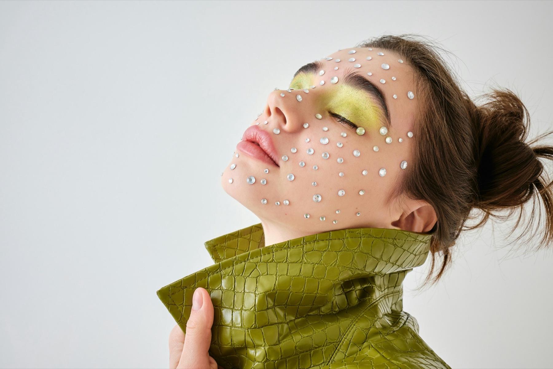 Crystals across a face, green croc collar