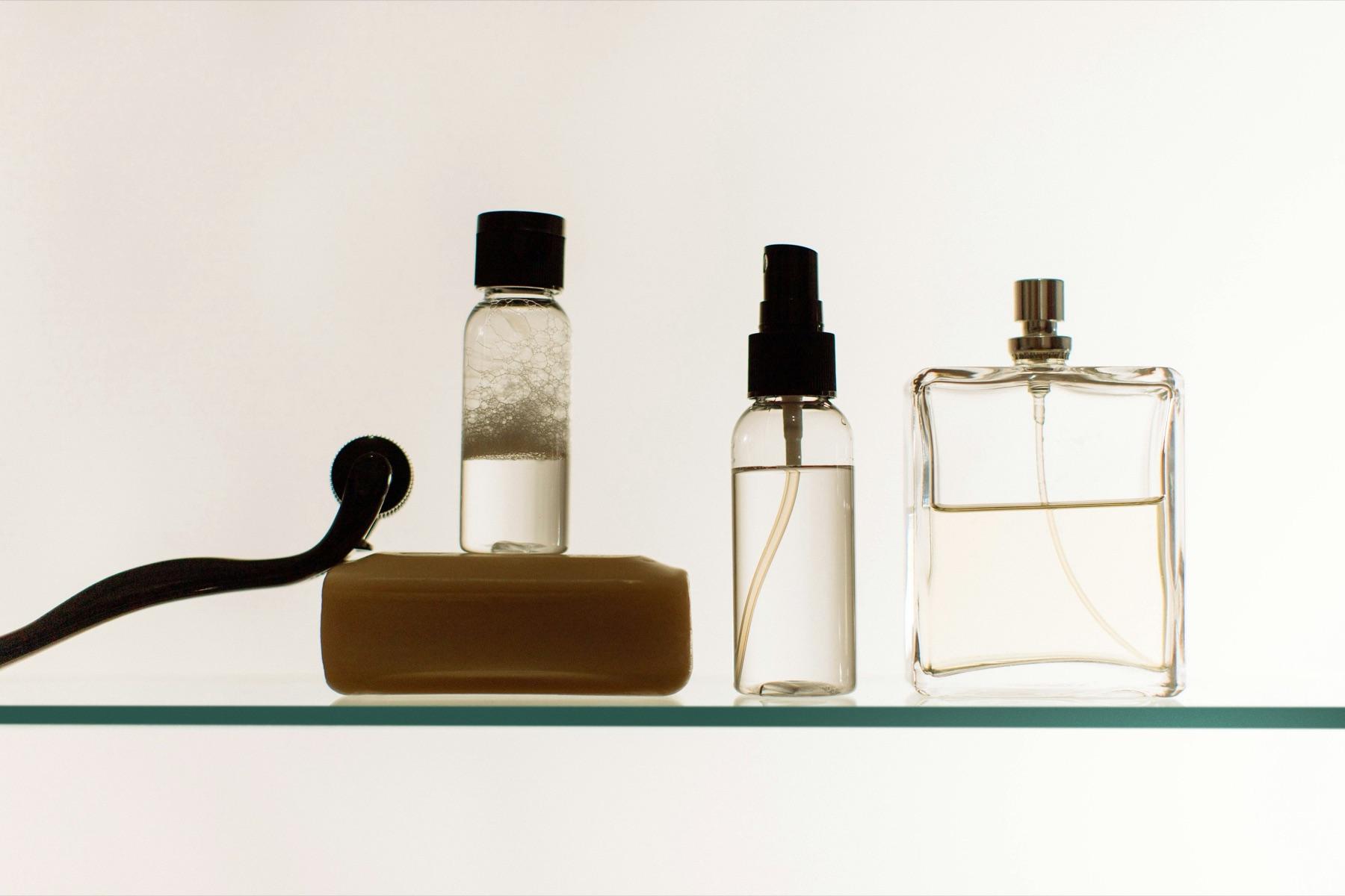 A backlit shelf of skincare