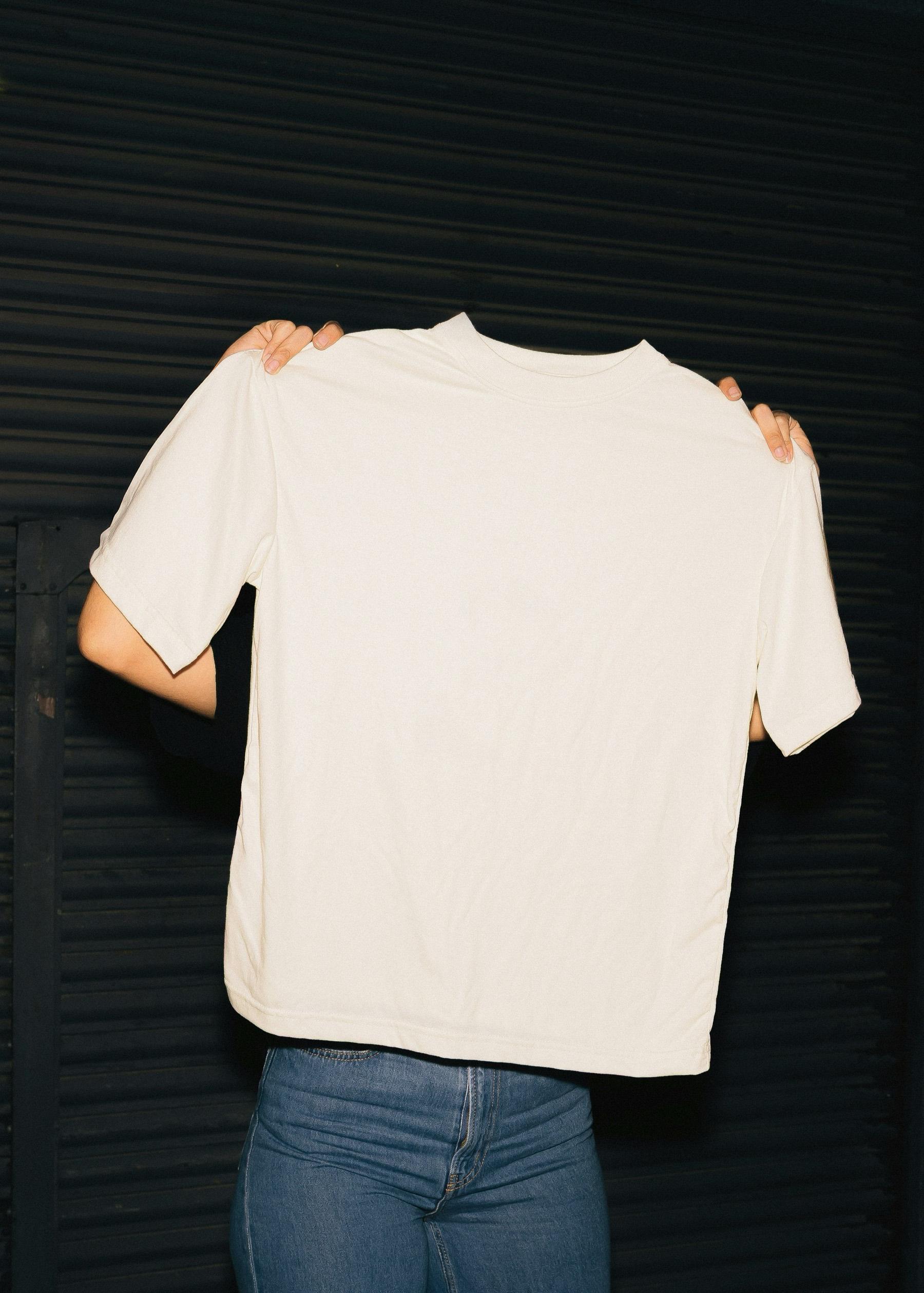 A white tee held up
