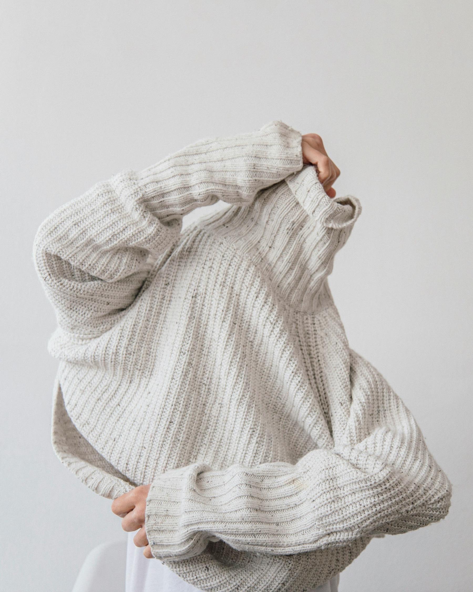 A cream ribbed knit, pulled overhead